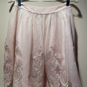 Light pink skirt with a pretty applique tulle layer over a base layer, medium.